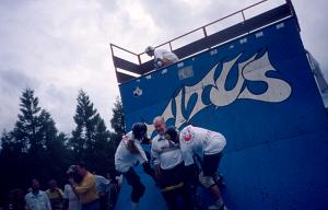Arne and Lars Languth<br> Triple with wheel chair<br> Location: Freiburg<br> Event: Lawine Tour 1992<br> Photographer: Bernhard Scheffold